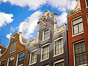 Row of typical historic house facades in Amsterdam