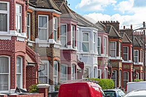 A row of typical red brick English terraced houses in London photo