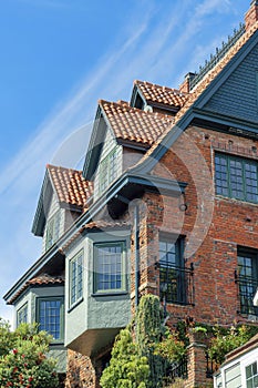 Row of units on appartment buildings in downtown San Francisco California detail shot of brick and green house or home