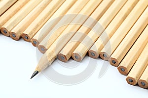 Row of unused pencil with one sharpened