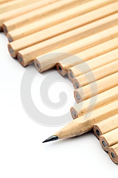 Row of unused pencil with one sharpened