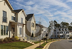 Row of upscale family homes on a curved neighborhood street