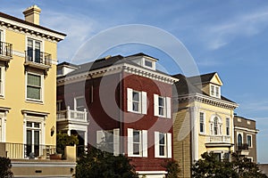 A row of upscale houses against blue sky