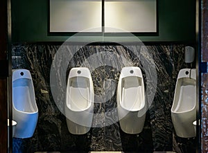 Row of urinal in Empty public men toilet