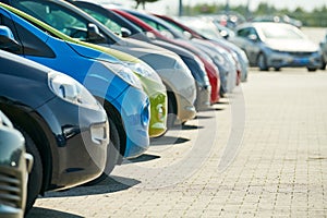 row of used cars. Rental or automobile sale services