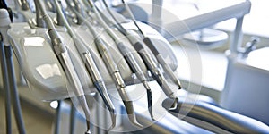 Row of various dental tools isolated on blue background.