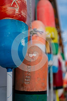Row of vibrant buoys adorning a waterfront structure