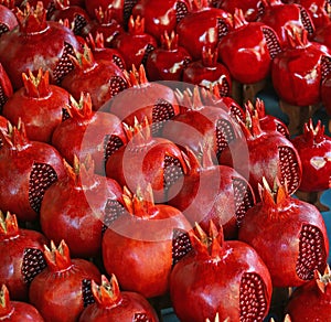 Row of Vibrant Red Wooden Pomegranates for Sale at the Vernissage Market in Yerevan, Armenia