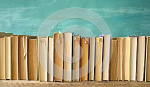 Row of vintage books, background or web banner free copy space.Reading, education, literature, book fair concept