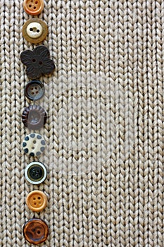 Row of Vintage Buttons Lined up on Soft Fabric Background