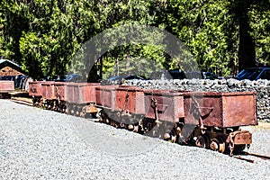 Row Of Vintage Rusty Ore Carts From Mining Operations