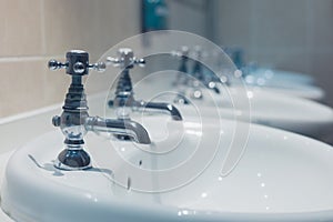 Row of wash basins in a bathroom