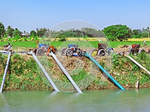 Row of water pump on trailer used to pump water from irrigation canal