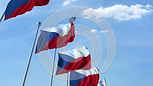 Row of waving flags of the Czech Republic agaist blue sky, 3D rendering