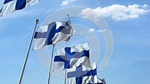 Row of waving flags of Finland agaist blue sky, 3D rendering