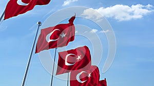 Row of waving flags of Turkey agaist blue sky, 3D rendering