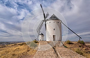 Row of white ad black windmills in Castilla La Manha village Spain photo