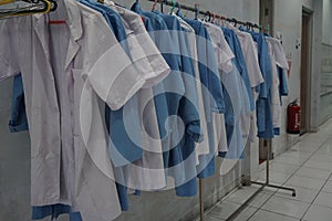 Row of White and Blue Laboratory Coat