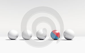 Row of white sphere and a beach ball .