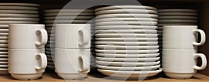 A Row White Tableware sat on a shelf