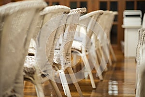 Row of white wedding chairs