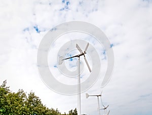 Row of White Wind Turbines for Electricity Generation