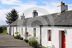 Row of whitewashed crofts in a Scottish village