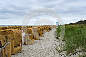 Row of wicker beach chairs on the Poel Island at the Eastern Sea, Germany