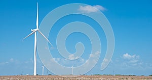 Wind turbines farm on cotton field at Corpus Christi, Texas, USA