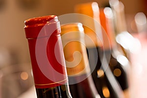 A Row of Wine Bottle Necks