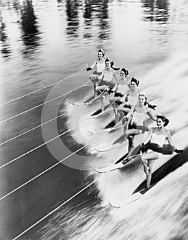 Row of women water skiing photo