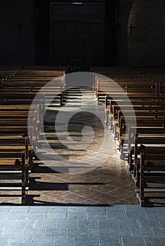 Row of wooden benches inside a church