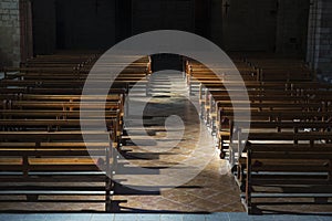 Row of wooden benches inside a church