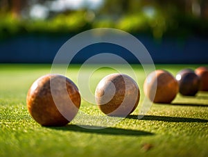 Row of wooden bocce balls on grass