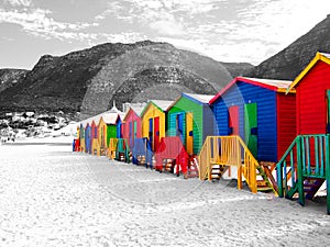 The row of wooden brightly colored huts.