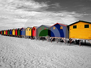 The row of wooden brightly colored huts. photo