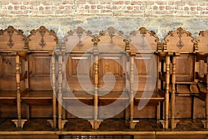Row of wooden chairs in an orthodox church