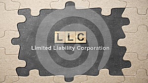 A row of wooden cubes with LLC text, the acronym of Limited Liability Company