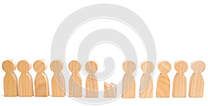 A row of wooden people and a broken figure of a person among them. The concept of a weak link. Did not give up to expectations and