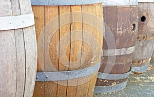 Row of wooden rain barrels