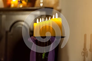 Row of yellow candles in the church