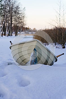 Rowboat on a beach in winter photo