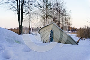 Rowboat on a beach in winter photo