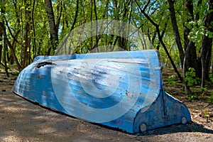 Rowboat with a broken side.