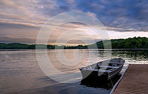 Rowboat Docked in a Lake at Sunset