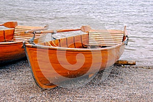 A rowboat at the edge of the lake