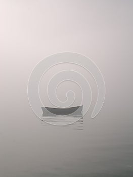 Rowboat in fog photo