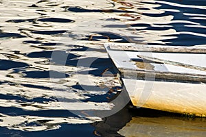 Rowboat in Late Afternoon Water with Reflections