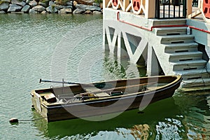 Rowboat beside marina stairs