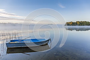 Rowboat on a Misty Lake in Autumn - Ontario, Canada photo